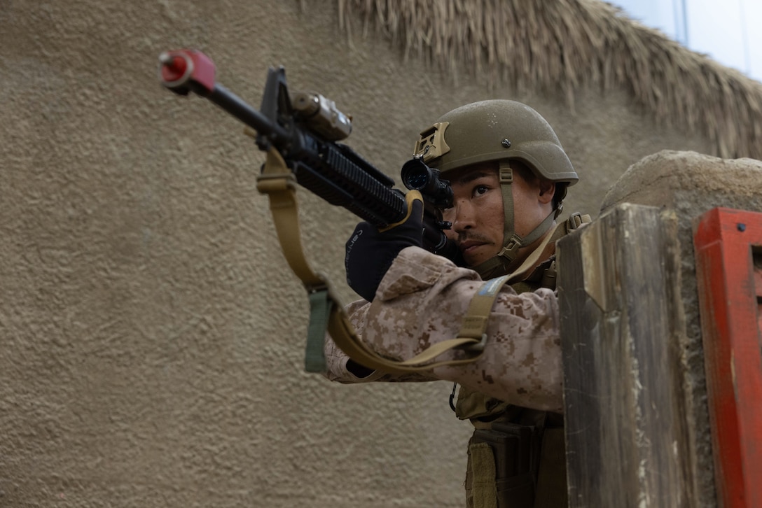 U.S. Marine Corps Capt. Hunter Roessler, a firepower control team leader with 4th Air Naval Gunfire Liaison Company, Force Headquarters Group, Marine Corps Forces Reserve, posts security during exercise Burmese Chase 25 at Marine Corps Base Camp Lejeune, North Carolina, Aug. 8, 2025. Burmese Chase is an annual U.S. led, multi-lateral training exercise comprised of integrating ground and air fires, infantry tactics and naval gunfire alongside NATO allies to enhance combat readiness and interoperability. (U.S. Marine Corps photo by LCpl. Weston Lindstrom.)