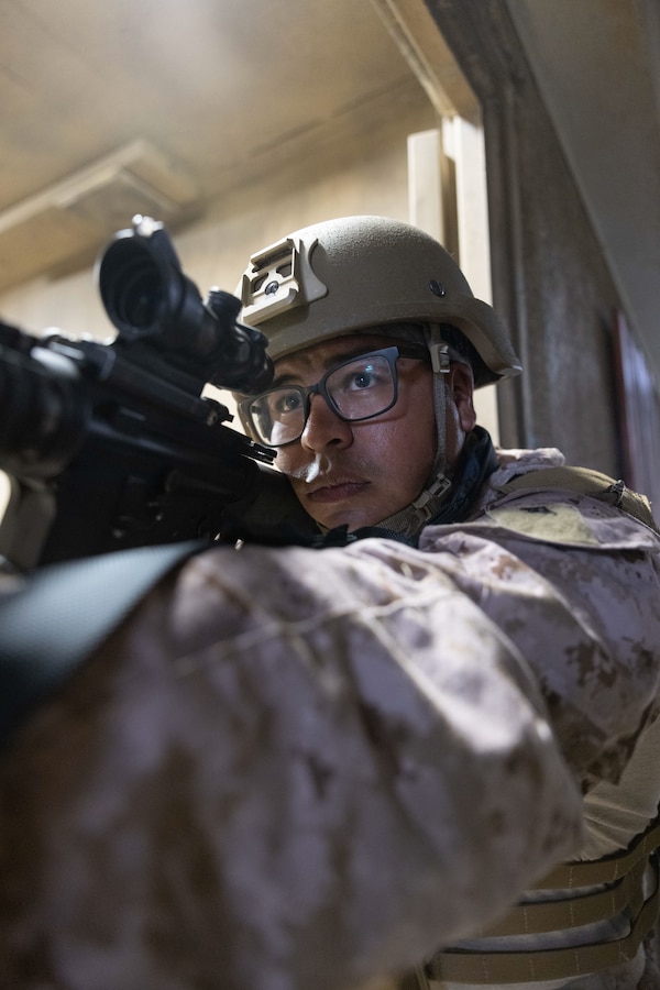 U.S. Marine Corps Lance Cpl. Roman Marcelino, a radio operator with 4th Air Naval Gunfire Liaison Company, Force Headquarters Group, Marine Corps Forces Reserve, posts security during exercise Burmese Chase 25 at Marine Corps Base Camp Lejeune, North Carolina, Aug. 8, 2025. Burmese Chase is an annual U.S. led, multi-lateral training exercise comprised of integrating ground and air fires, infantry tactics and naval gunfire alongside NATO allies to enhance combat readiness and interoperability. (U.S. Marine Corps photo by LCpl. Weston Lindstrom)