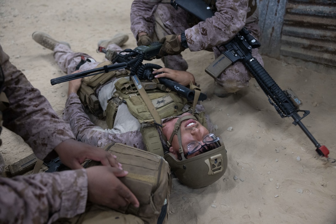 U.S. Marine Corps Cpl. Augustin Rivetti, a forward observer with 4th Air Naval Gunfire Liaison Company, Force Headquarters Group, Marine Corps Forces Reserve, acts as a simulated causality during exercise Burmese Chase 25 at Marine Corps Base Camp Lejeune, North Carolina, Aug. 8, 2025. Burmese Chase is an annual U.S. led, multi-lateral training exercise comprised of integrating ground and air fires, infantry tactics and naval gunfire alongside NATO allies to enhance combat readiness and interoperability. (U.S. Marine Corps photo by LCpl. Weston Lindstrom)