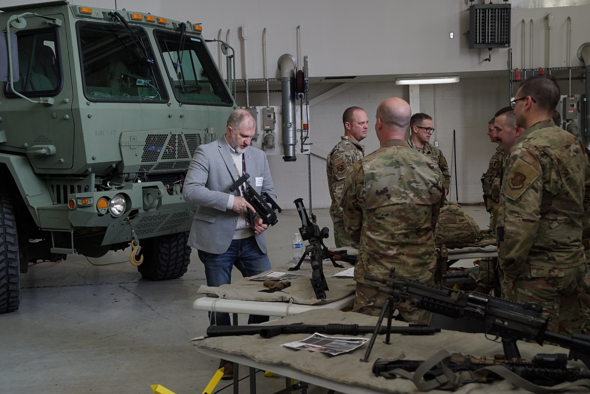 Robert Blackthorn, founder and managing director of Techforge Solutions, a veteran owned technology startup, learns about the 178th Security Forces mission, during the 2025 Springfield Air National Guard Base Community Day, on base in Springfield, Ohio, April 10, 2025. The event consisted of many briefings on the wing’s capabilities, a base tour, and an equipment display. (U.S. Air National Guard photo by Staff. Sgt. Jillian Maynus)