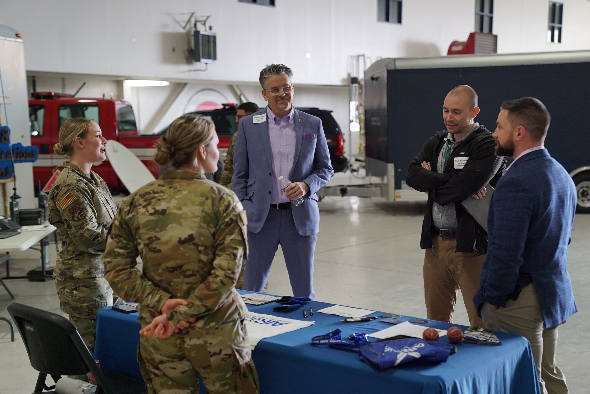 Community members visit the 178th Wing recruiting booth, during the 2025 Springfield Air National Guard Base Community Day, on base in Springfield, Ohio, April 10, 2025. The attendees toured hands-on displays of tools and technology used to fulfill the wing’s mission, including security forces small arms, mobile popup kitchen, and fire equipment. (U.S. Air National Guard photo by Staff. Sgt. Jillian Maynus)