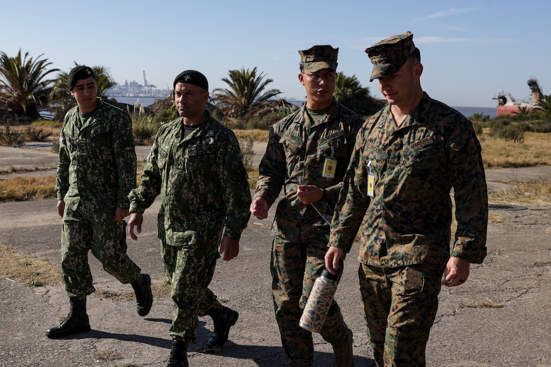 U.S. Marines and Uruguayan marine corps members discuss boat raid topics during a subject matter expert exchange in Uruguay, August 11, 2025. This subject matter expert exchange enhances the training and readiness standards for the United States and Uruguay as well as facilitating the exchange of formalized readiness standards between both countries. (U.S. Marine Corps photo by Sgt. Eduardo Delatorre)