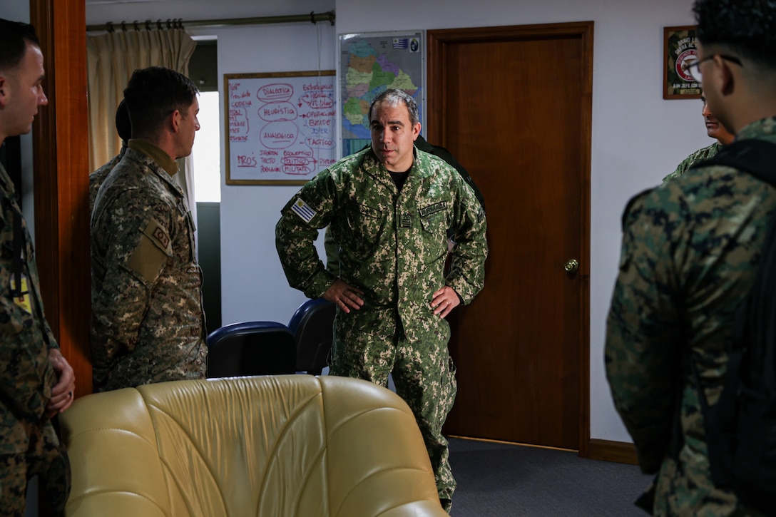 Capitan de Navio Sergio Sar, Comandante de la Infanteria de Marina de Uruguay, greets Uruguayan service members and U.S. Marines during a subject matter expert exchange in Uruguay, August 11, 2025. This subject matter expert exchange enhances the training and readiness standards for the United States and Uruguay as well as facilitating the exchange of formalized readiness standards between both countries. (U.S. Marine Corps photo by Sgt. Eduardo Delatorre)