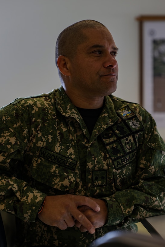 Suboficial de Segunda John Gonzales, jefe del peloton de Embarcaciones, observes the structure of U.S. Marine Corps boat raids during a subject matter expert exchange in Uruguay, August 11, 2025. This subject matter expert exchange enhances the training and readiness standards for the United States and Uruguay as well as facilitating the exchange of formalized readiness standards between both countries. (U.S. Marine Corps photo by Sgt. Eduardo Delatorre)