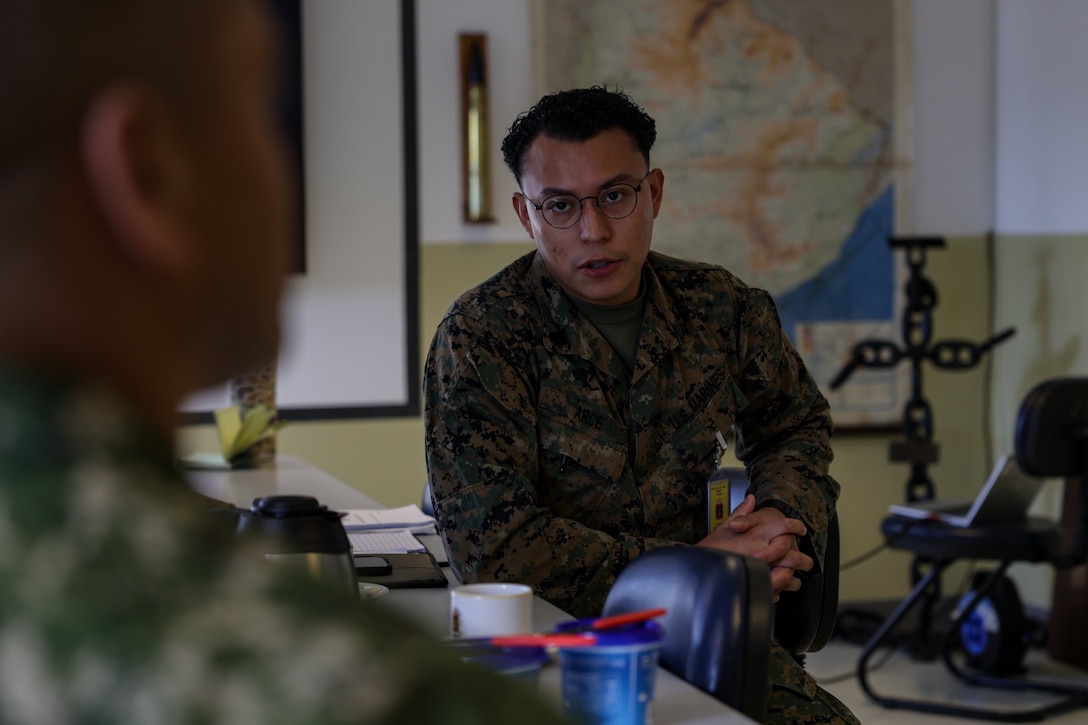 U.S. Marine Corps Sgt. Ronald Arce, an infantry rifleman with U.S. Marine Forces, South, translates raid processes to members of La Infanteria de Marina de Uruguay during a subject matter expert exchange  in Uruguay, August 11, 2025. This subject matter expert exchange enhances the training and readiness standards for the United States and Uruguay as well as facilitating the exchange of formalized readiness standards between both countries. Arce is a native of Texas. (U.S. Marine Corps photo by Sgt. Eduardo Delatorre)