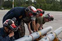 U.S. Marines with Marine Attack Squadron 223 prepare AV-8B Harriers for ordnance training