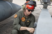 U.S. Marines with Marine Attack Squadron 223 prepare AV-8B Harriers for ordnance training