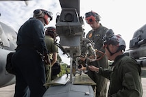 U.S. Marines with Marine Attack Squadron 223 prepare AV-8B Harriers for ordnance training