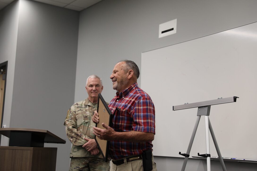 Roger Cunningham accepts the Honorary Guardsman award during a ceremony at Boone National Guard Center in Frankfort, Kentucky, Aug. 5, 2025.