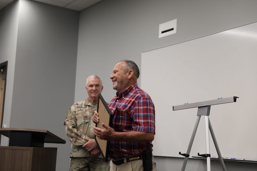 Roger Cunningham accepts the Honorary Guardsman award during a ceremony at Boone National Guard Center in Frankfort, Kentucky, Aug. 5, 2025.