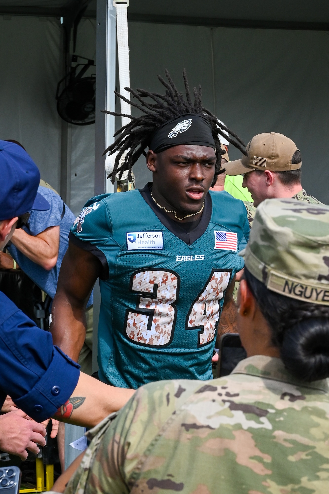 Philadelphia Eagles running back Montrell Johnson Jr. runs onto the field during training camp at the NovaCare Complex in Philadelphia, July 26, 2025. The Philadelphia Eagles joined forces with the USO centers of Pennsylvania, New Jersey, and Delaware to host active-duty, Reserve, and National Guard personnel from across the tri-state region for a day of appreciation.(U.S. Air National Guard photo by Staff Sgt. Charles Casner)