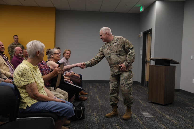 U.S. Army Maj. Gen. Haldane B. Lamberton, Kentucky's adjutant general, presents the Honorary Guardsman award to the family of Nick Feldman during a ceremony at Boone National Guard Center in Frankfort, Kentucky, Aug. 5, 2025.