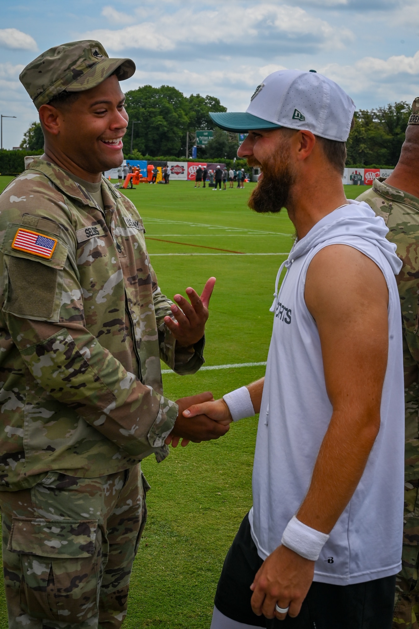 Philadelphia Eagles kicker Jake Elliott greets a U.S. Army Soldier during Military Appreciation Day at the NovaCare Complex in Philadelphia, July 26, 2025. Bringing together the military community and professional sports, the Eagles and tri-state USO teams honored the service and sacrifice of troops from across Pennsylvania, New Jersey, and Delaware. (Pennsylvania Air National Guard photo by Staff Sgt. Charles Casner)