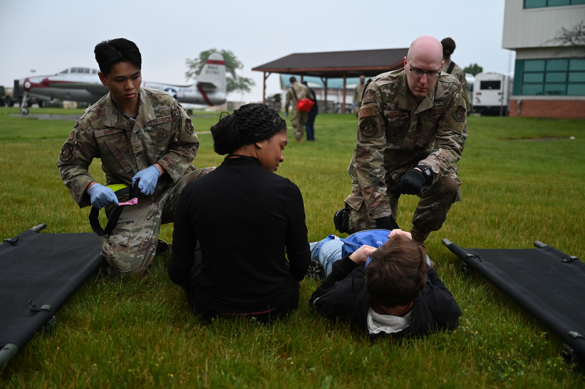 Airmen assigned to the 445th Aeromedical Staging Squadron conducted initial evaluation and first aid on role-players June 7, 2025, at the 178th Ohio Air National Guard Base in Springfield, Ohio, as part of Exercise Relentless Valor. The large-scale medical exercise ensured higher command readiness requirements were met through coordinated medical care on the ground and in the air. (U.S. Air National Guard photo by Staff Sgt. Colin Simpson)