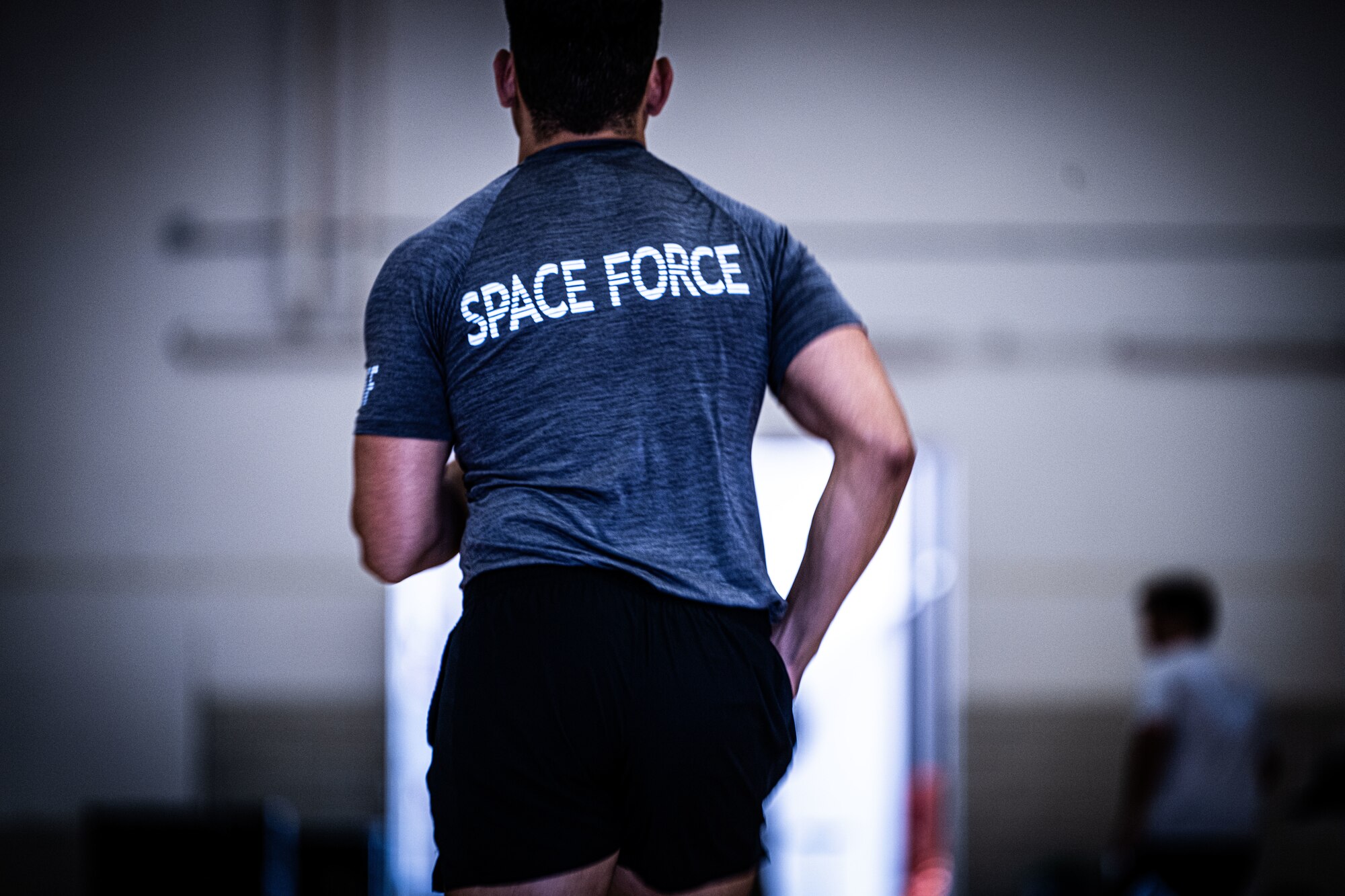 A U.S. Space Force Guardian runs in a physical training uniform.