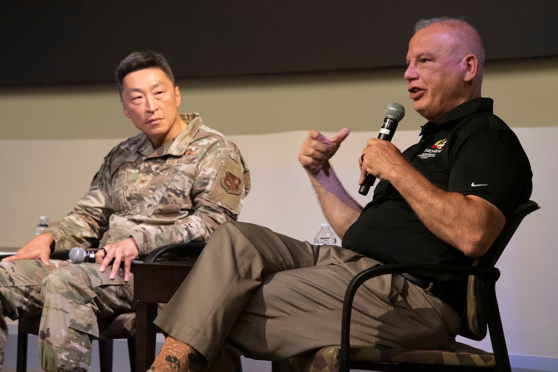 U.S. Air Force Col. Jun S. Oh, 316th Wing and installation commander, listens to Edward C. Rothstein, Maryland Department of Veterans and Military Families secretary, at the "Mission Strong” summit Aug. 8, 2025, at the Gen. Jacob E. Smart Conference Center at Joint Base Andrews, Maryland. The event focused on issues impacting military families, veterans and the surrounding communities.