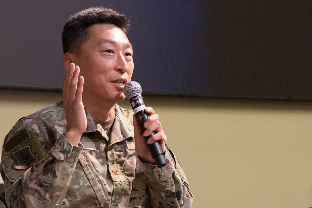 U.S. Air Force Col. Jun S. Oh,  316th Wing and installation commander, speaks during the "Mission Strong” summit Aug. 8, 2025, at the Gen. Jacob E. Smart Conference Center at Joint Base Andrews, Maryland. Oh highlighted the importance of family support for military readiness and retention, mentioning programs like spouse employment assistance and family advocacy.