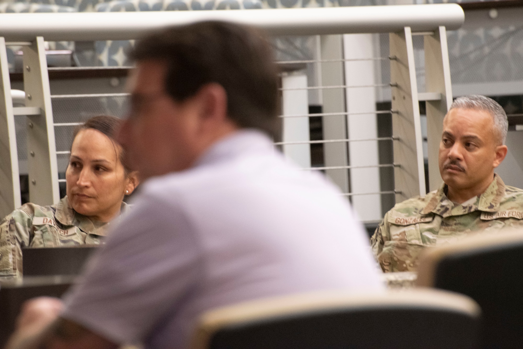 U.S. Air Force Col. Wendy A.P. Davitch, 316th Mission Support Group commander, and U.S. Air Force Chief Master Sgt. Alejandro E. Gonzalez, 316th MSG senior enlisted advisor, listen to remarks during the "Mission Strong” summit Aug. 8, 2025, at the Gen. Jacob E. Smart Conference Center at Joint Base Andrews, Maryland. The event brought together Department of Defense stakeholders, community partners, and key leaders to discuss issues impacting military families, veterans and the surrounding communities.