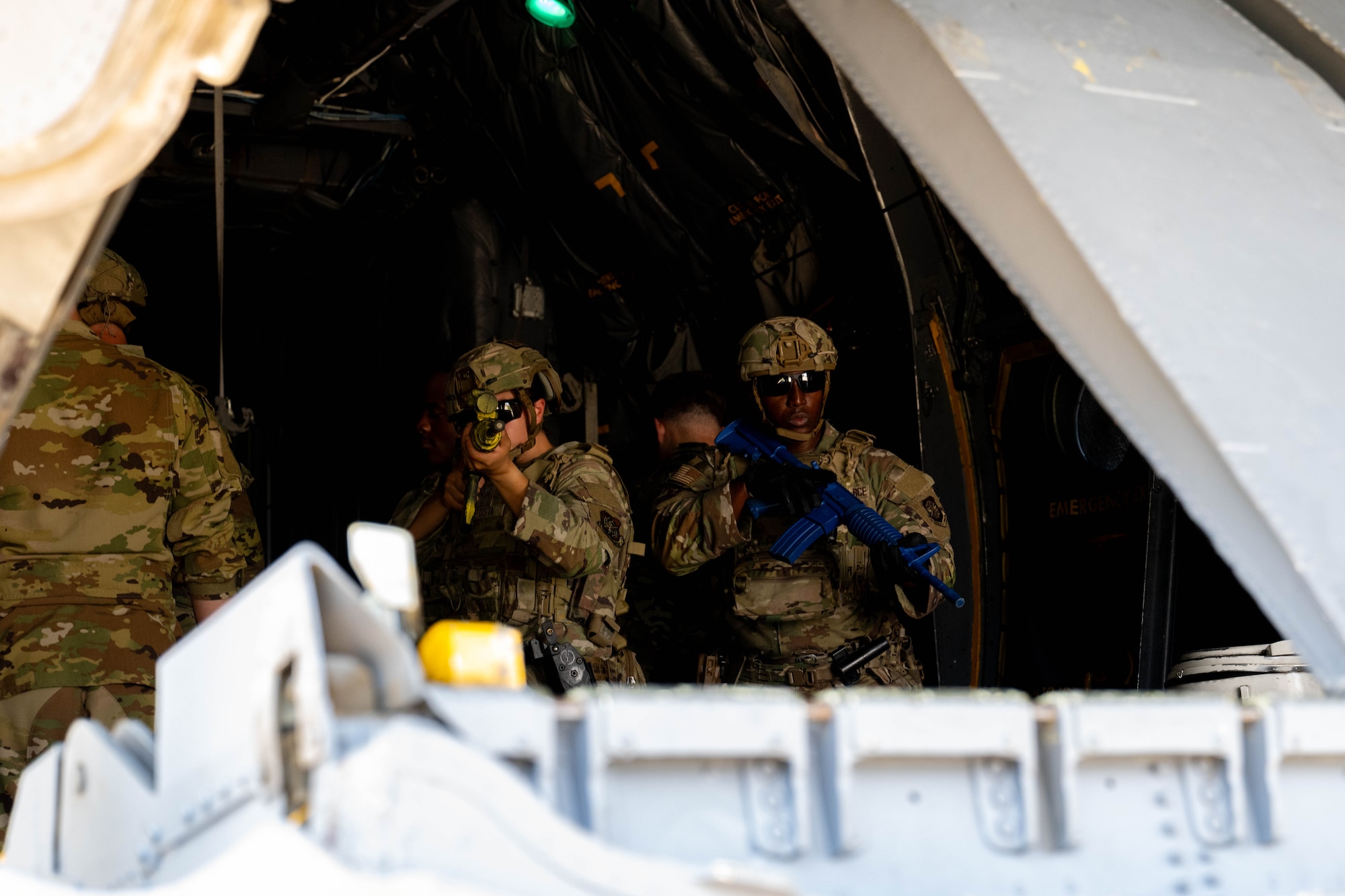 Airmen provide security aboard plane