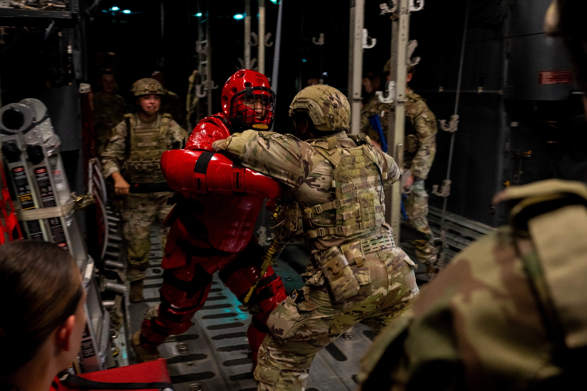 Airman performs combatives against man in protective suit
