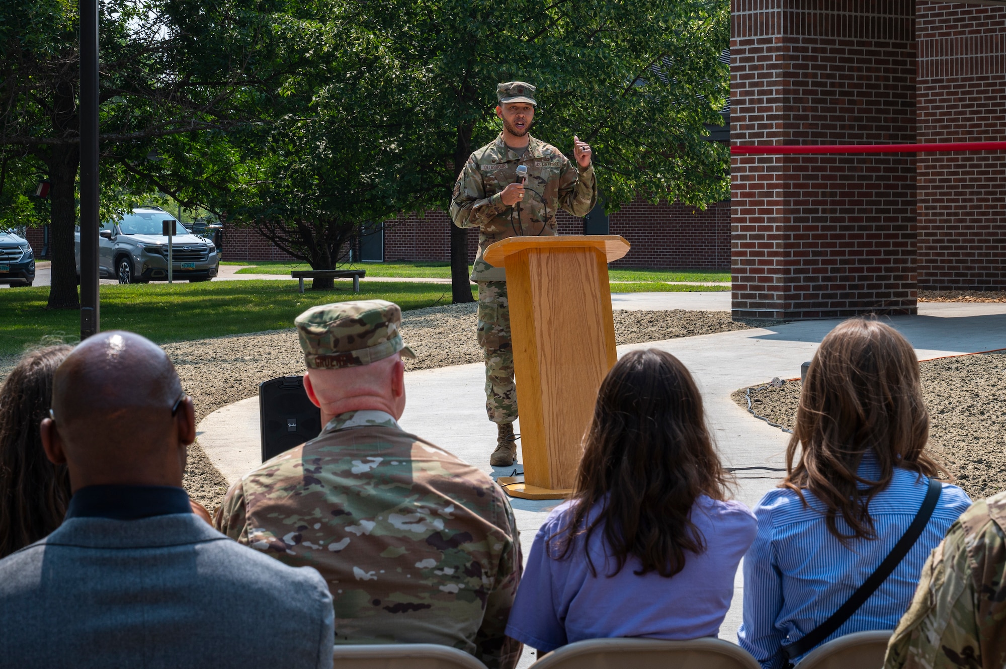 A picture of a man standing infront of a crowd.
