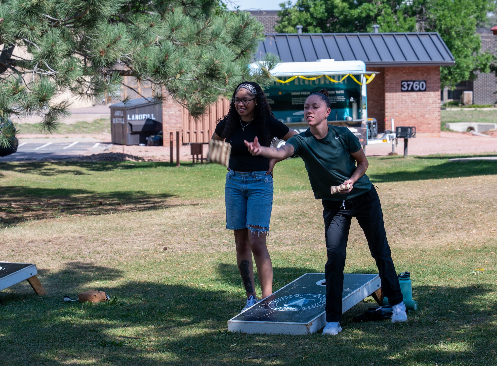 Participants play cornhole at one of the locations for Forge the Force Fest