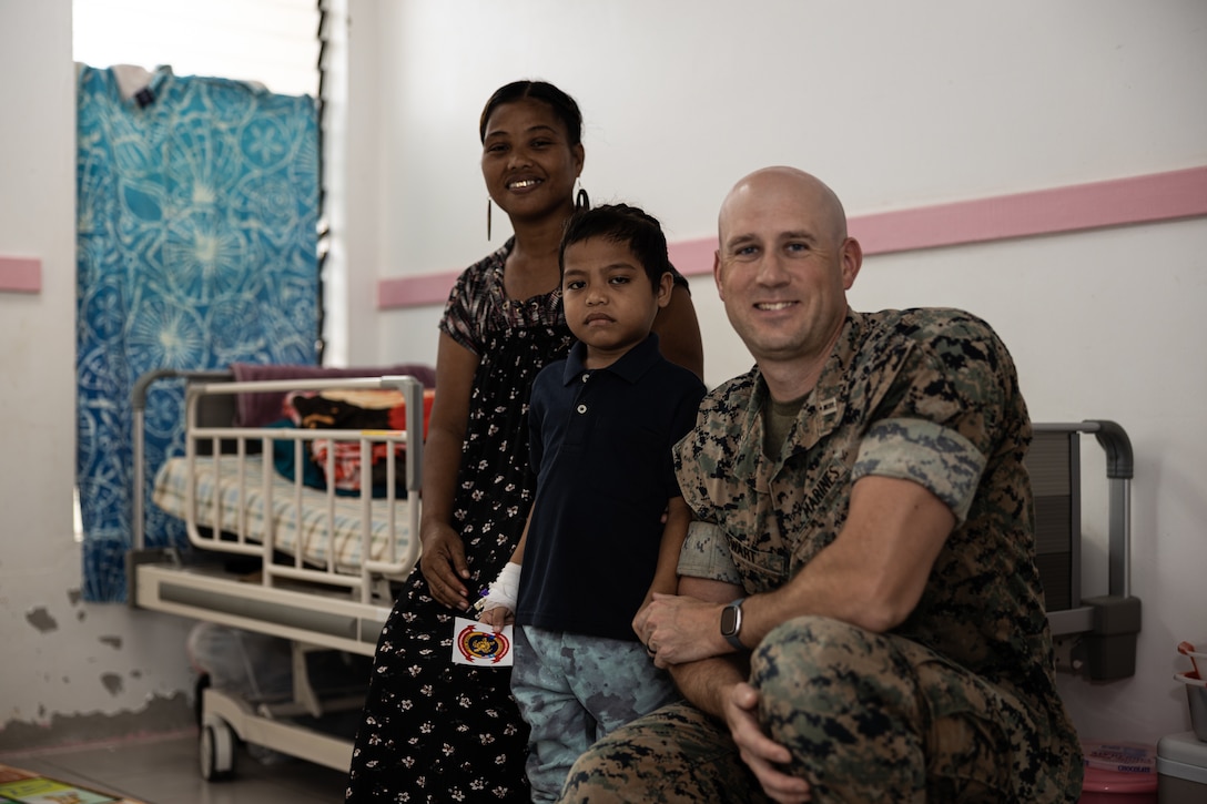 U.S. Marine Corps Capt. Jared Swart, an operations officer with Combat Logistics Battalion 15, Combat Logistics Regiment 17, 1st Marine Logistics Group, poses for a photo with the local Chuukese child he donated blood to and his mother during Koa Moana 25 on Chuuk, Federated States of Micronesia, August 10, 2025. Koa Moana 25 is an annual partnership in the Indo-Pacific region that strengthens established relationships, bolsters theater security cooperation, and enhances the resilience of our allies and partners through community outreach, medical and civic assistance, infrastructure improvement projects, and key leader exchanges. (U.S. Marine Corps photo by Cpl. Ryan Ramsammy)