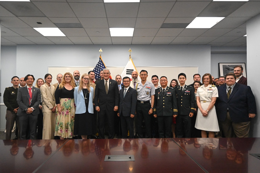 Members of the Defense POW/MIA Accounting Agency and the Republic of Korea Ministry of National Defense Agency for KIA Recovery and Identification pose for a photo commemorating the signing of a Memorandum of Understanding in Arlington, Virginia, solidifying the two agencies’ commitment to recovering and identifying remains of service members missing from the Korean War, Aug. 6, 2025.
