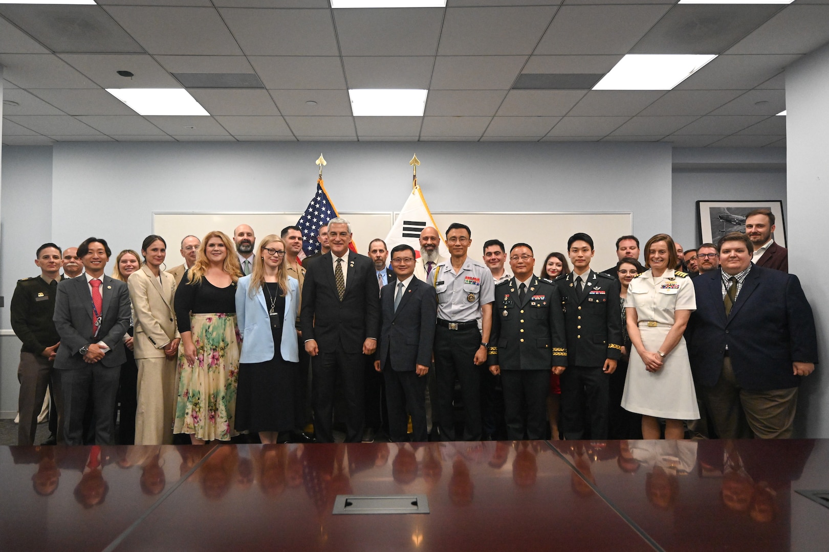 Members of the Defense POW/MIA Accounting Agency and the Republic of Korea Ministry of National Defense Agency for KIA Recovery and Identification pose for a photo commemorating the signing of a Memorandum of Understanding in Arlington, Virginia, solidifying the two agencies’ commitment to recovering and identifying remains of service members missing from the Korean War, Aug. 6, 2025.