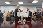 The Defense POW/MIA Accounting Agency Director, Kelly McKeague, left, and the Republic of Korea Ministry of National Defense Agency for KIA Recovery and Identification Director, Keun-Won Lee, present the signed Memorandum of Understanding in Arlington, Virginia, solidifying their agencies’ commitment to recovering and identifying remains of service members missing from the Korean War, Aug. 6, 2025.