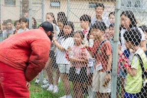 An Airman talks to students about military working dogs.