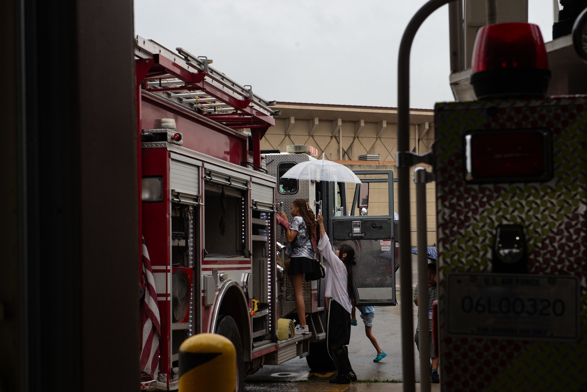 Students climb a trick truck.