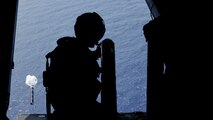 U.S. Marine Corps Cpl. Tristan Courtney, a crew chief with Marine Medium Tiltrotor Squadron (VMM) 265 (Rein.), 31st Marine Expeditionary Unit, deploys buoys during anti-submarine warfare training, in the Philippine Sea, Aug. 8, 2025.