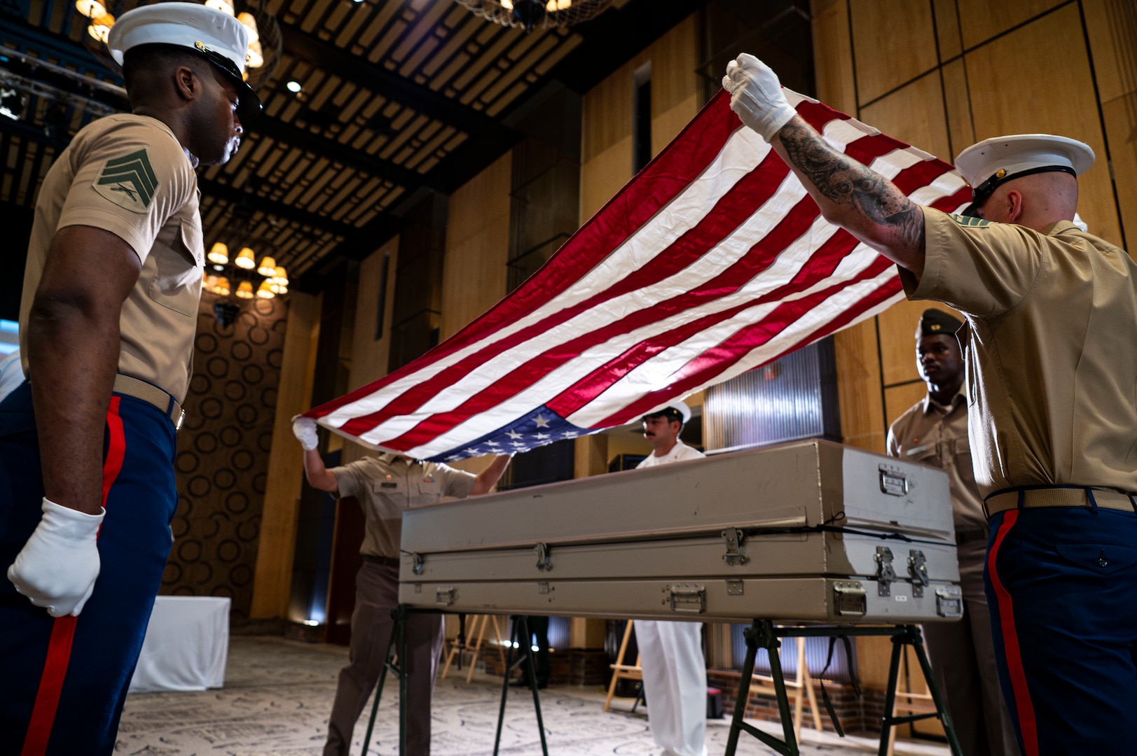 An American flag is draped over a casket holding potential remains during a repatriation ceremony in Da Nang Province, Vietnam, July 25, 2025.