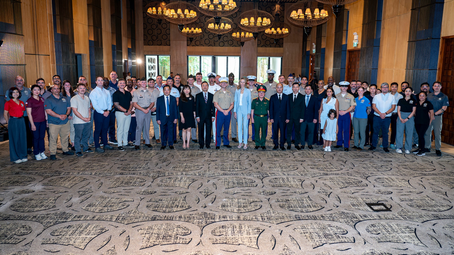 Members of 25-3VN Underwater Recovery Team for the Defense POW/MIA Accounting Agency, Vietnam Detachment 2, and Vietnamese Office for Seeking Missing Persons pose for a photo with Courtney Beal, U.S. Embassy Hanoi deputy chief of mission, following a repatriation ceremony in Da Nang Province, Vietnam, July 25, 2025.