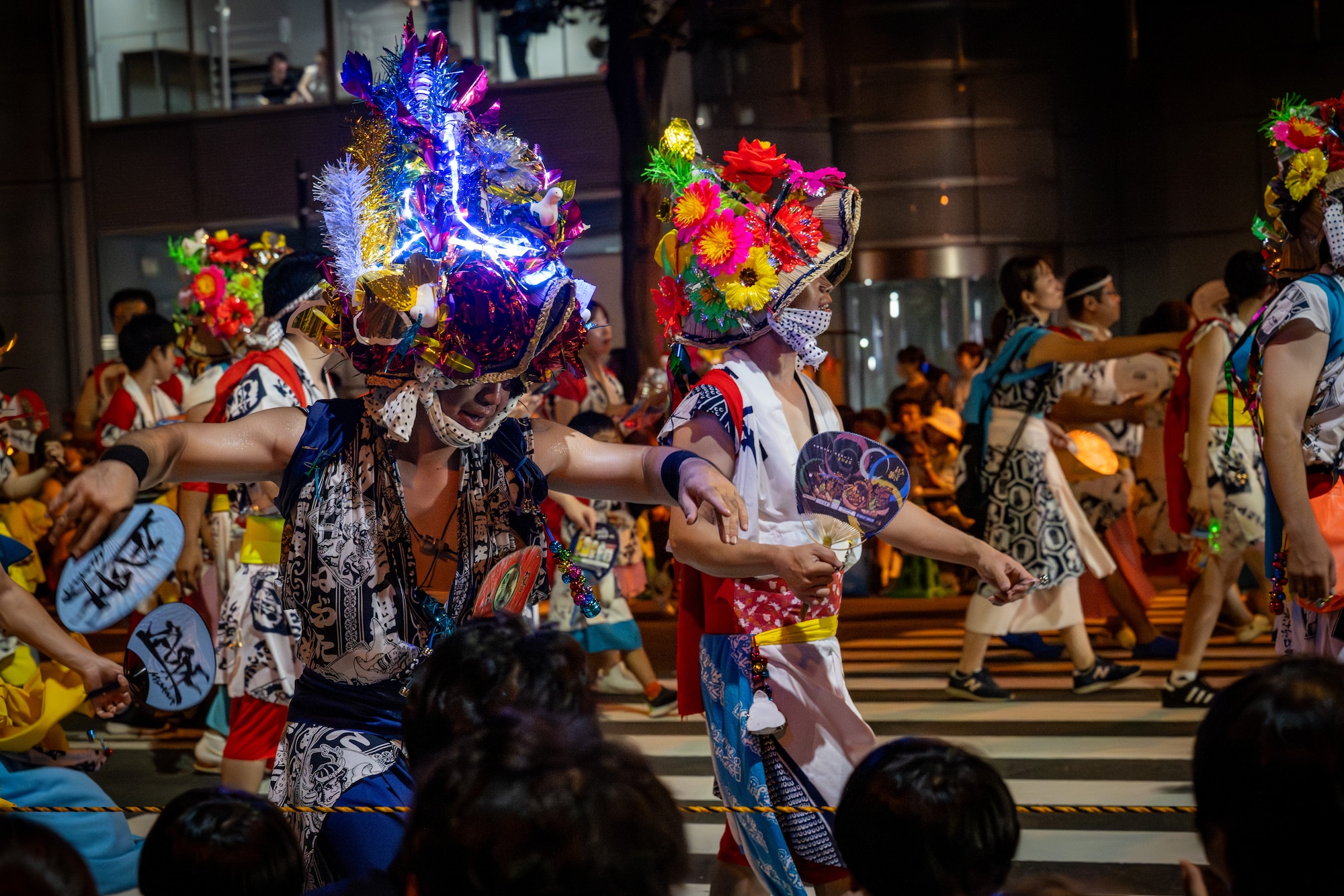 Haneto dancers call the crowd to dance in the parade during the annual Nebuta Festival at Aomori City, Japan.