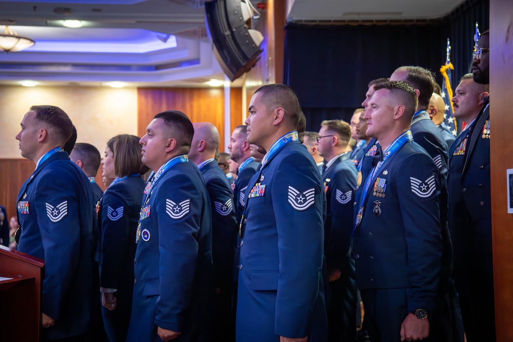 U.S. Air Force members stand at attention.