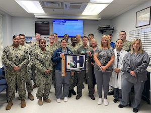 Navy Medicine Readiness and Training Unit (NMRTU) Dahlgren staff celebrate the Silver Eagle "Blue H" award for 2024. Four local Naval Medical Commands have earned prestigious recognition for their outstanding contributions to health promotion and wellness. NMRTC Patuxent River oversees Naval Medical Readiness Training Unit (NMRTU) Dahlgren, NMRTC Detachment Indian Head, and NMRTC Detachment Joint Base Andrews (JBA).  All four commands have been recognized by the Navy Surgeon General, as receiving the Navy Surgeon General's Health Promotion and Wellness Award for 2024.