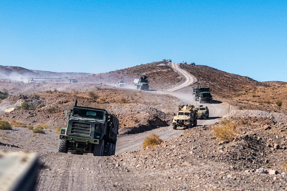 U.S. Marines with Combat Logistics Battalion, 2d Marine Logistic Group, 2d Marine Division convoys as part of Advanced Motorized Operations Course during Service Level Training Exercise 4-25, at Marine Corps Air-Ground Combat Center, Twentynine Palms, California, July 24, 2025. SLTE 4-25 is designed to be a challenging, realistic training environment that produces combat-ready forces capable of operating as an integrated Marine Air Ground Task Force across all domains of military operations. (U.S. Marine Corps photo by Lance Cpl. Judith Ann Lazaro)