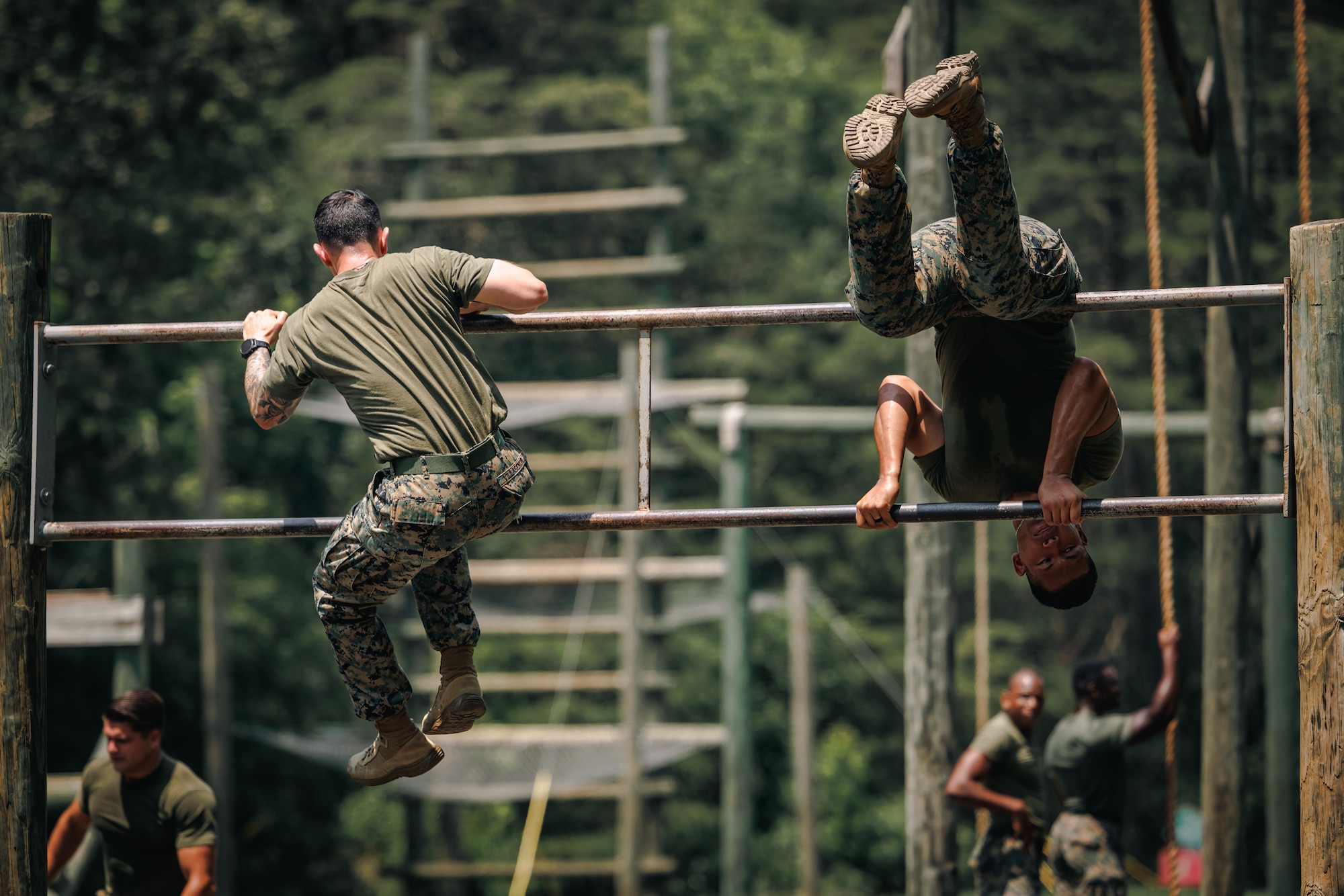 Students with Force Fitness Instructor Course 3-25 conduct the obstacle course at The Basic School on Marine Corps Base Quantico, Virginia, June 12, 2025. The FFI course trains Marines to improve their warfighting capability to maximize unit physical readiness and optimize mental and physical performance. (U.S. Marine Corps photo by Lance Cpl. Braydon Rogers)