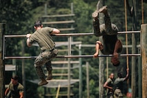 Students with Force Fitness Instructor Course 3-25 conduct the obstacle course at The Basic School on Marine Corps Base Quantico, Virginia, June 12, 2025. The FFI course trains Marines to improve their warfighting capability to maximize unit physical readiness and optimize mental and physical performance. (U.S. Marine Corps photo by Lance Cpl. Braydon Rogers)