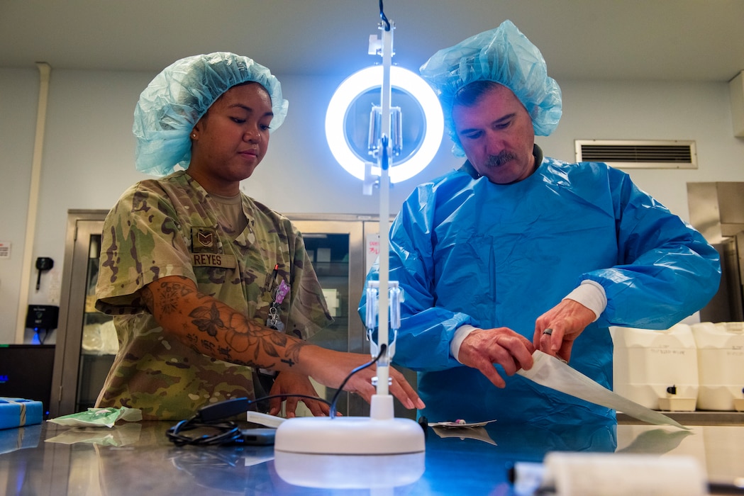 U.S. Air Force Staff Sgt. Erika Reyes, 39th Operational Medical Readiness Squadron infection control NCO in charge, and Col. Albert Esposito, 39th Air Base Wing commander, prepare medical instruments at Incirlik Air Base, Türkiye, Aug. 8, 2025.