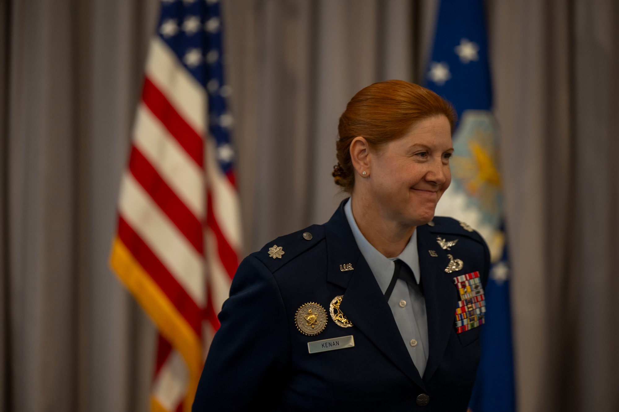 U.S. Air Force Lt. Col. Kathryn Kenan, 5th Intelligence Support Squadron commander, smiles during her assumption of command ceremony.