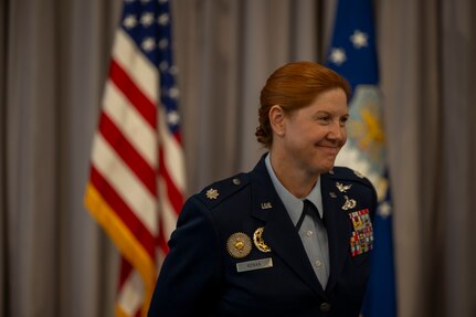 U.S. Air Force Lt. Col. Kathryn Kenan, 5th Intelligence Support Squadron commander, smiles during her assumption of command ceremony.