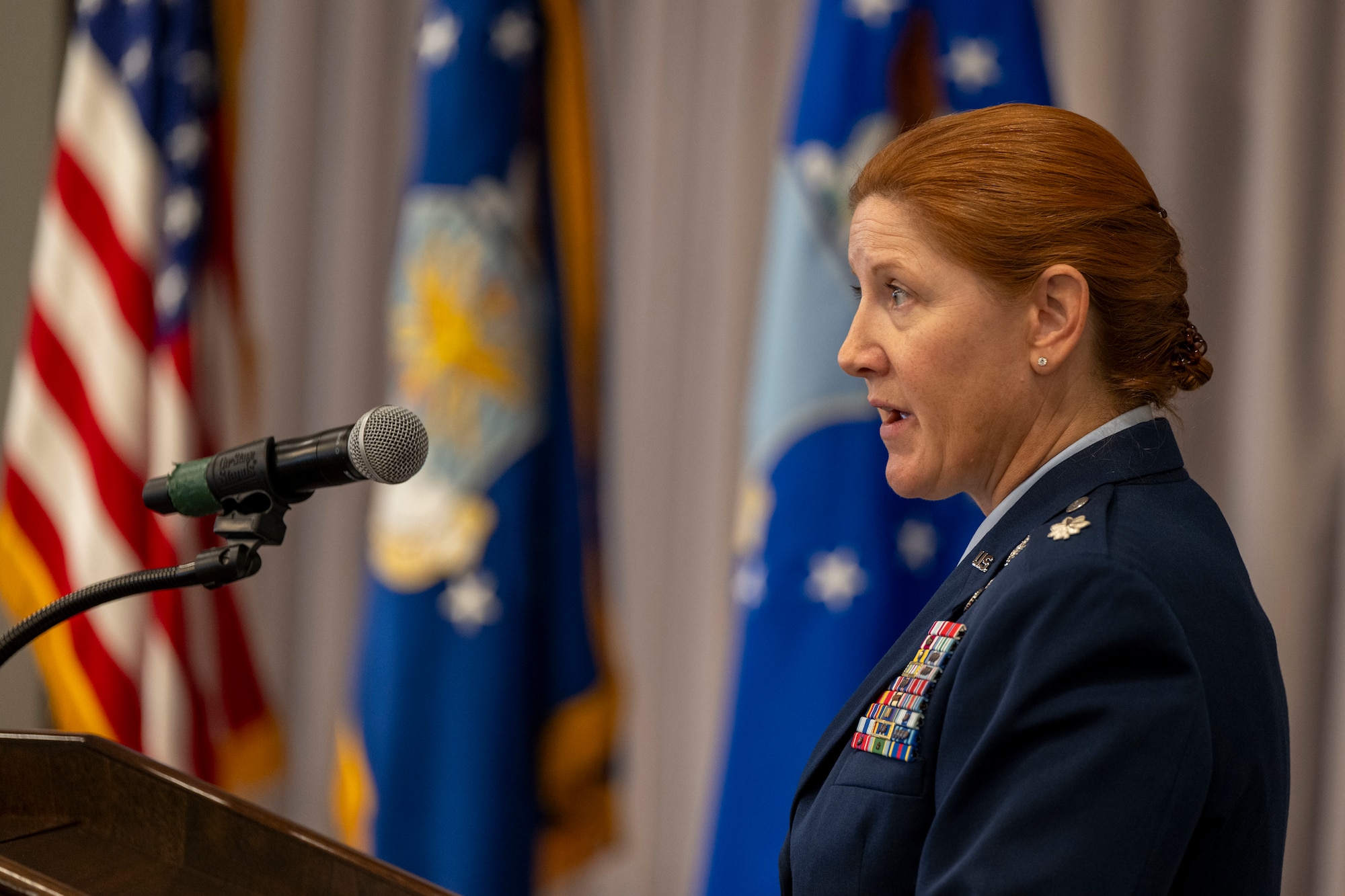 U.S. Air Force Lt. Col. Kathryn Kenan, 5th Intelligence Support Squadron commander, gives remarks during her assumption of command ceremony.