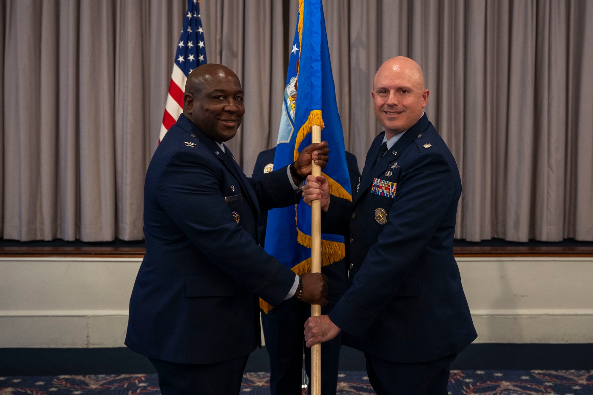 U.S. Air Force Lt. Col. Chad Polumbo, right, takes command of the 2nd Intelligence Squadron as Col. Ryan L. O’Neal, left, 77th Intelligence Wing commander, presides over the assumption of command ceremony at Joint Base Anacostia-Bolling, July 29, 2025.