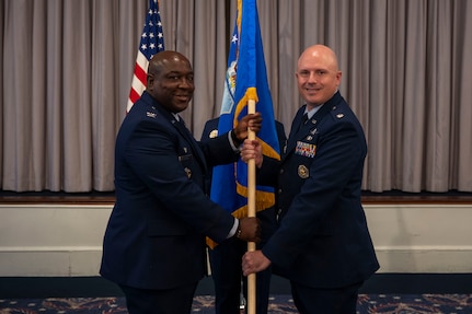 U.S. Air Force Lt. Col. Chad Polumbo, right, takes command of the 2nd Intelligence Squadron as Col. Ryan L. O’Neal, left, 77th Intelligence Wing commander, presides over the assumption of command ceremony at Joint Base Anacostia-Bolling, July 29, 2025.
