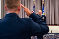 U.S. Air Force Lt. Col. Chad Polumbo, commander of the 2nd Intelligence Squadron, receives his first salute from Maj. David Moore, 2nd Intelligence Squadron Director of Operations, during an assumption of command ceremony at Joint Base Anacostia-Bolling, July 29, 2025.