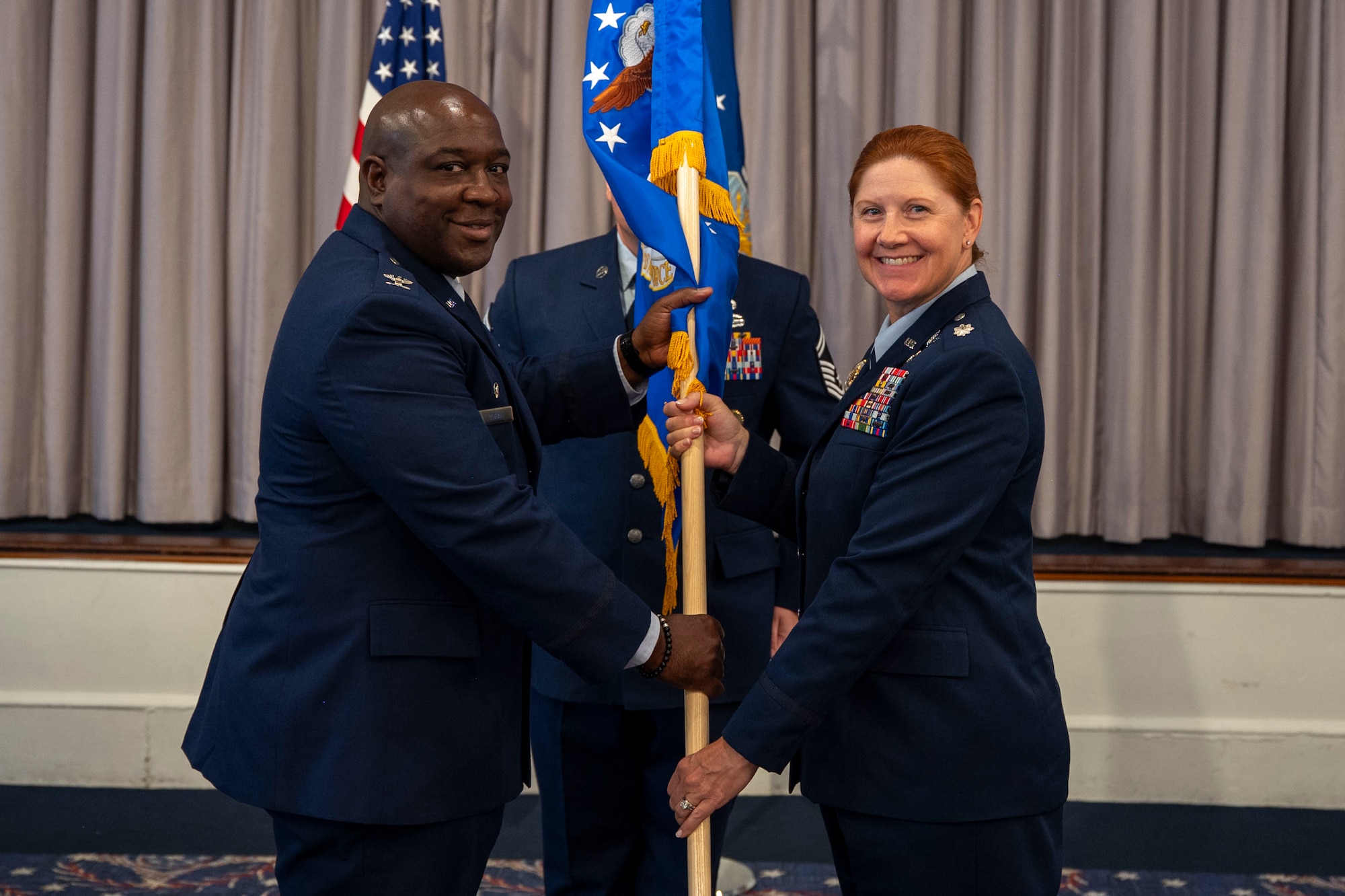 U.S. Air Force Lt. Col. Kathryn Kenan, right, takes command of the 5th Intelligence Support Squadron as Col. Ryan L. O’Neal, left, 77th Intelligence Wing commander, presides over the assumption of command ceremony at Joint Base Anacostia-Bolling, July 29, 2025.
