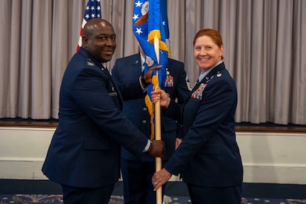 U.S. Air Force Lt. Col. Kathryn Kenan, right, takes command of the 5th Intelligence Support Squadron as Col. Ryan L. O’Neal, left, 77th Intelligence Wing commander, presides over the assumption of command ceremony at Joint Base Anacostia-Bolling, July 29, 2025.